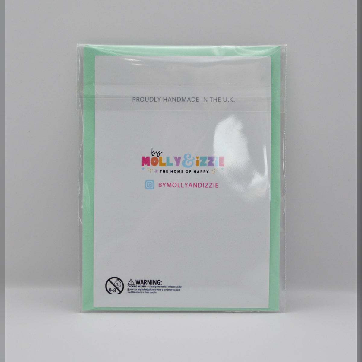 Self Love Club card backing design with brand name 'Molly&Izzie' displayed alongside a choking hazard warning in the lower left corner. 