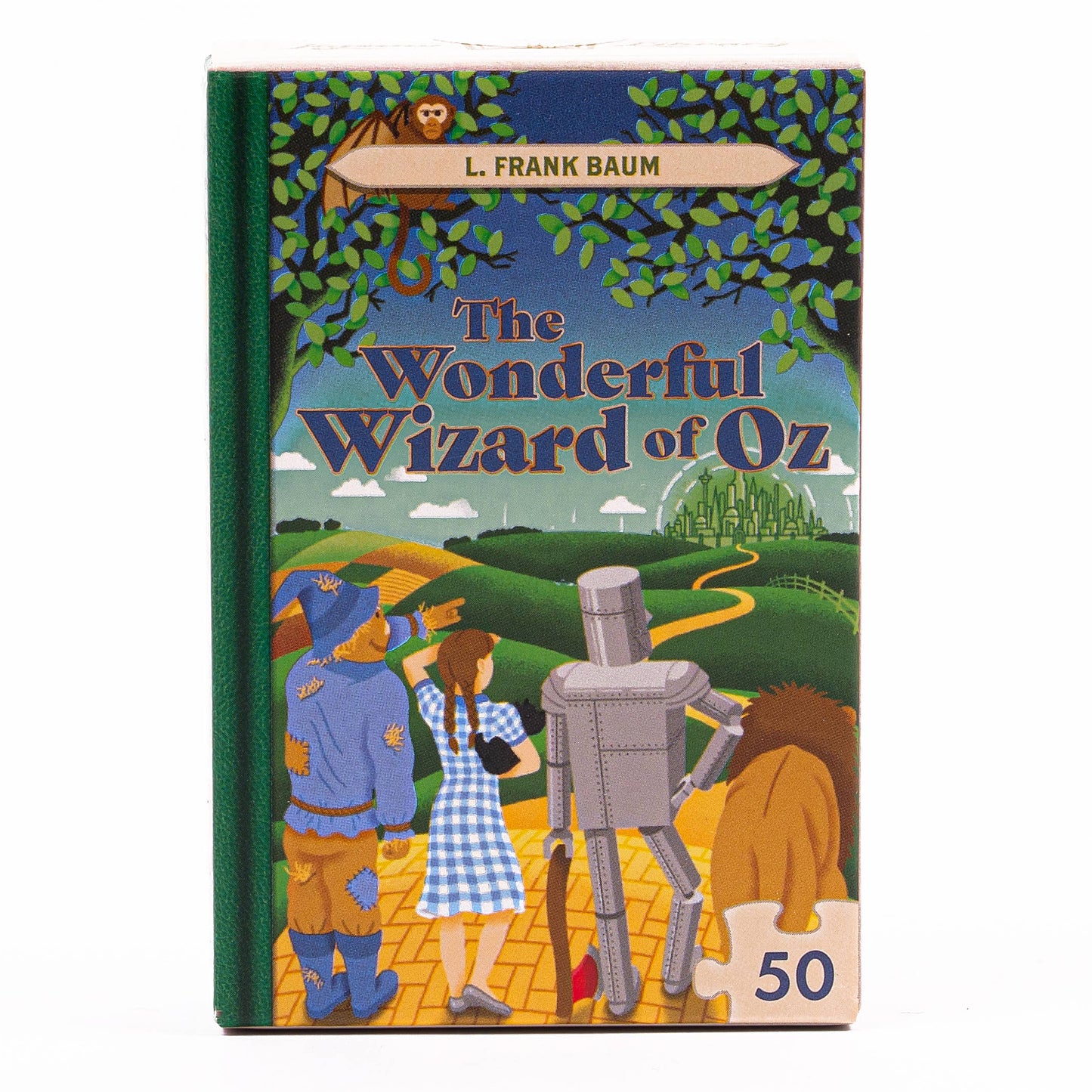 Wonderful Wizard of Oz themed jigsaw puzzle with colours of blue, greens and yellow. Emerald city is in the background with the yellow brick road leading up to the foreground where Dorothy is holding Toto the dog standing next to the Scarecrow, the Tin man and the Cowardly Lion. 