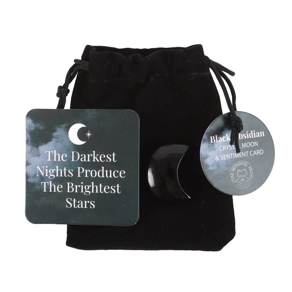 Black obsidian crystal, sentiment card, and black drawstring bag on a white background