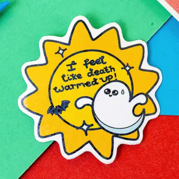 A yellow sun shaped sticker with a cartoon bat and ghost with text that reads 'I feel like death warmed up!'.